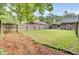 Spacious backyard featuring a privacy fence and view of the home's brick exterior, perfect for Gathering activities at 815 Temple Rd # B, Ladson, SC 29456