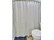 Bathroom featuring toilet, shower/tub combo with curtain, and tile flooring at 815 Temple Rd # B, Ladson, SC 29456