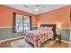 Cozy bedroom with floral bedding, wood floors, and a window at 815 Temple Rd # B, Ladson, SC 29456