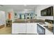 Open-concept kitchen featuring granite countertops and modern appliances overlooking the cozy living room at 815 Temple Rd # B, Ladson, SC 29456