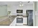 Functional kitchen with granite countertops, white cabinets, and modern appliances at 815 Temple Rd # B, Ladson, SC 29456