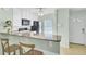 Charming kitchen with a breakfast bar, white cabinets, and modern appliances, perfect for casual dining at 815 Temple Rd # B, Ladson, SC 29456