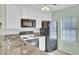 Well-lit kitchen with modern appliances, granite countertops, and a clean, white backsplash at 815 Temple Rd # B, Ladson, SC 29456