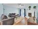 Bright living room with a fireplace, hardwood floors, and sliding doors to the backyard at 815 Temple Rd # B, Ladson, SC 29456