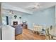 Cozy living room with a white brick fireplace, wood floors, and plenty of natural light at 815 Temple Rd # B, Ladson, SC 29456