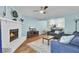Open living area with brick fireplace, hardwood floors, and view to breakfast area at 815 Temple Rd # B, Ladson, SC 29456