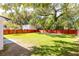 Large backyard featuring green grass, a privacy fence and shade trees at 83 Avondale Ave, Charleston, SC 29407