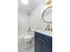 Updated bathroom with blue vanity, gold hardware, and stylish tile at 83 Avondale Ave, Charleston, SC 29407