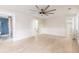 Bright bedroom featuring hardwood floors, shiplap, modern ceiling fan, and a bathroom with herringbone tiling at 83 Avondale Ave, Charleston, SC 29407
