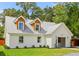 Charming exterior of a newly renovated home with dormer windows and fresh landscaping at 83 Avondale Ave, Charleston, SC 29407