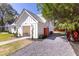 Beautiful home featuring an open garage and a well-maintained gravel driveway at 83 Avondale Ave, Charleston, SC 29407