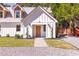 Charming home featuring a welcoming front entrance with a manicured lawn at 83 Avondale Ave, Charleston, SC 29407
