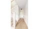 Bright hallway with beautiful hardwood floors, shiplap walls, and a staircase with a modern railing at 83 Avondale Ave, Charleston, SC 29407
