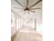 Living room offers natural light through many windows, wood floors, and a modern ceiling fan at 83 Avondale Ave, Charleston, SC 29407