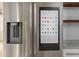Stainless steel refrigerator featuring a built-in touchscreen display with available apps at 83 Avondale Ave, Charleston, SC 29407