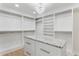 Bright, spacious walk-in closet with center island, granite countertop, and ample storage at 83 Avondale Ave, Charleston, SC 29407