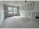Bedroom features newly installed drywall, electrical outlets, and large windows at 855 Descartes St, Summerville, SC 29486
