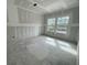 A well-lit bedroom space featuring newly installed drywall and large windows at 855 Descartes St, Summerville, SC 29486