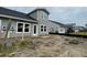 Exterior view of new construction showing gray siding, black roof, and modern windows at 855 Descartes St, Summerville, SC 29486