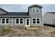 Exterior view of the new gray siding, black roof, and modern double-hung windows at 855 Descartes St, Summerville, SC 29486
