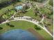 Aerial view featuring community amenities with walking paths, seating, and a beautiful pond at 857 Descartes St, Summerville, SC 29486