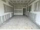 Unfinished two car garage with drywall installed on the walls and ceiling ready for painting at 857 Descartes St, Summerville, SC 29486