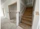Staircase under construction, featuring wooden steps and a metal handrail support system at 857 Descartes St, Summerville, SC 29486