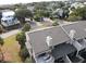 Aerial view of the neighborhood with mature trees and lake views at 9 Fairway Dunes Ln, Isle of Palms, SC 29451