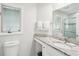 Bright bathroom with a vanity, and glass-enclosed shower at 9 Fairway Dunes Ln, Isle of Palms, SC 29451