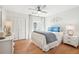 Bright bedroom featuring a ceiling fan, closet, and balcony access at 9 Fairway Dunes Ln, Isle of Palms, SC 29451