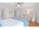 The bedroom features neutral paint, a ceiling fan, and a comfortably adorned bed at 9 Fairway Dunes Ln, Isle of Palms, SC 29451