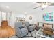 Cozy living room with hardwood floors, comfortable seating, and stylish decor creating an inviting atmosphere at 9 Fairway Dunes Ln, Isle of Palms, SC 29451