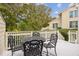 Charming patio with decorative metal table and chairs at 9 Fairway Dunes Ln, Isle of Palms, SC 29451