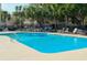Sparkling community pool with lounge chairs and mature landscaping at 9 Fairway Dunes Ln, Isle of Palms, SC 29451