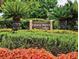 Fairway Dunes Villas sign nestled amongst lush tropical landscaping at 9 Fairway Dunes Ln, Isle of Palms, SC 29451