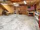 Large basement with exposed beams, storage shelves, and a spacious open area for projects at 104 Bryant St, Saint George, SC 29477