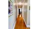 Hallway featuring hardwood floors, neutral decor and light colored walls at 104 Bryant St, Saint George, SC 29477