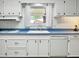 Well-maintained kitchen featuring classic cabinetry, and plenty of counter space at 104 Bryant St, Saint George, SC 29477