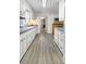 Bright kitchen featuring white cabinets, white walls, and modern appliances at 104 Bryant St, Saint George, SC 29477