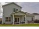 Inviting backyard patio with comfortable seating, dining area, and outdoor grill at 107 Belgian Ct, Summerville, SC 29486