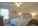 Cozy bedroom with a comfortable bed, ceiling fan, dresser and coral artwork at 107 Belgian Ct, Summerville, SC 29486