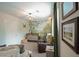 Charming Bedroom with woodland mural, crib, glider, and neutral tones at 107 Belgian Ct, Summerville, SC 29486