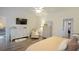 Bright bedroom with a ceiling fan, dresser, TV, and comfortable chair at 107 Belgian Ct, Summerville, SC 29486