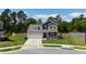 Two-story home with a two car garage and inviting front porch located on a manicured lot at 107 Belgian Ct, Summerville, SC 29486