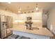 Open concept kitchen with a granite countertop island, stainless steel appliances, and ample cabinet space at 107 Belgian Ct, Summerville, SC 29486