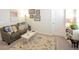 Living room featuring a comfortable sofa, patterned rug, and horse statuette at 107 Belgian Ct, Summerville, SC 29486