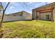 Green backyard features a nice lawn, white fences, and wood pergola at 116 Bright Meadow Rd, Summerville, SC 29483