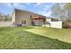 Fenced backyard features a grassy lawn, white fence, and wood pergola at 116 Bright Meadow Rd, Summerville, SC 29483