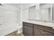 Bright bathroom features a double sink vanity, a full sized mirror and a tub-shower at 116 Bright Meadow Rd, Summerville, SC 29483
