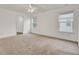 This bright bedroom features neutral carpet, two windows and a ceiling fan at 116 Bright Meadow Rd, Summerville, SC 29483